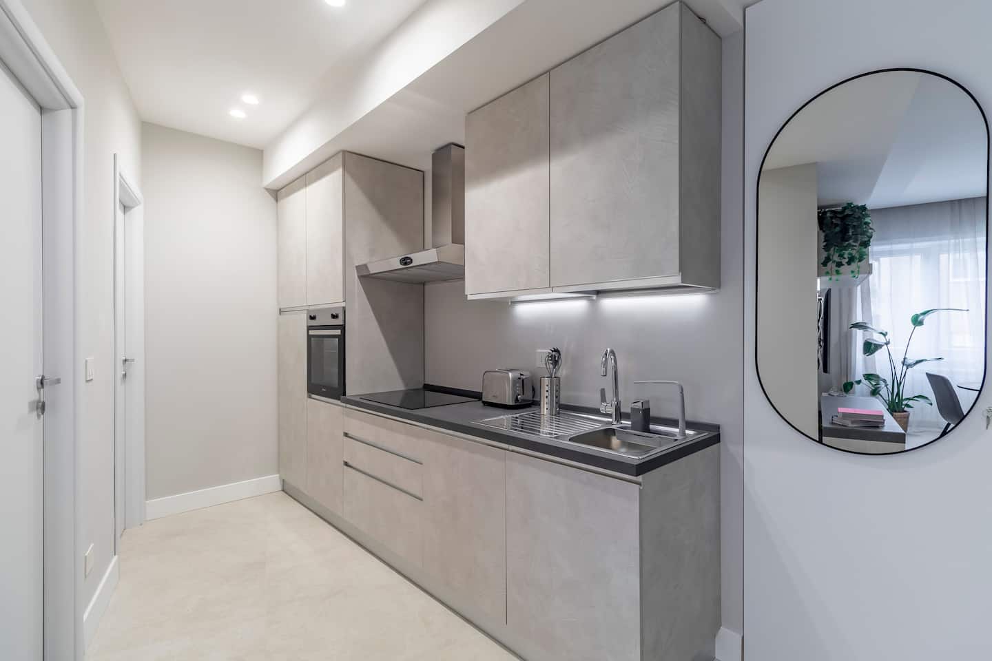 Fitted kitchen with hob and oven