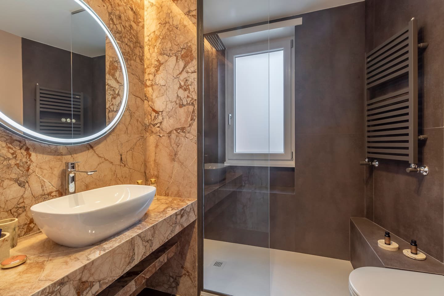 Marble bathroom with vessel sink and walk-in shower